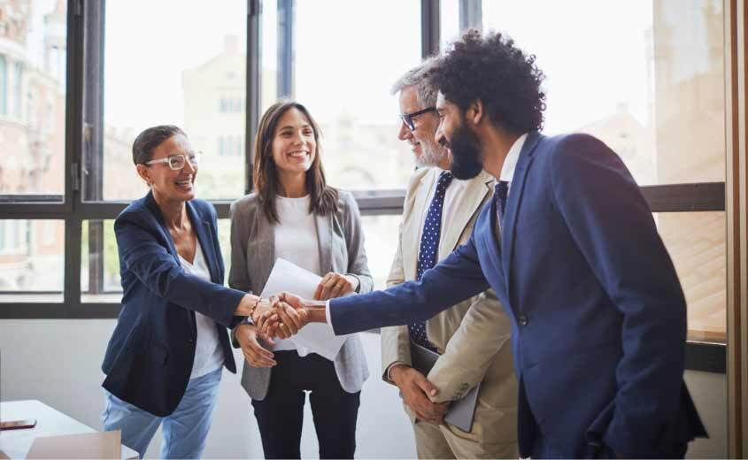 Group of people shaking hands